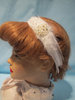 White hair band with feathers and rhinestones