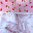 Vaaleanpunapohjainen, kirsikkakuvioinen käsityöpuuvilla, lev 110cm